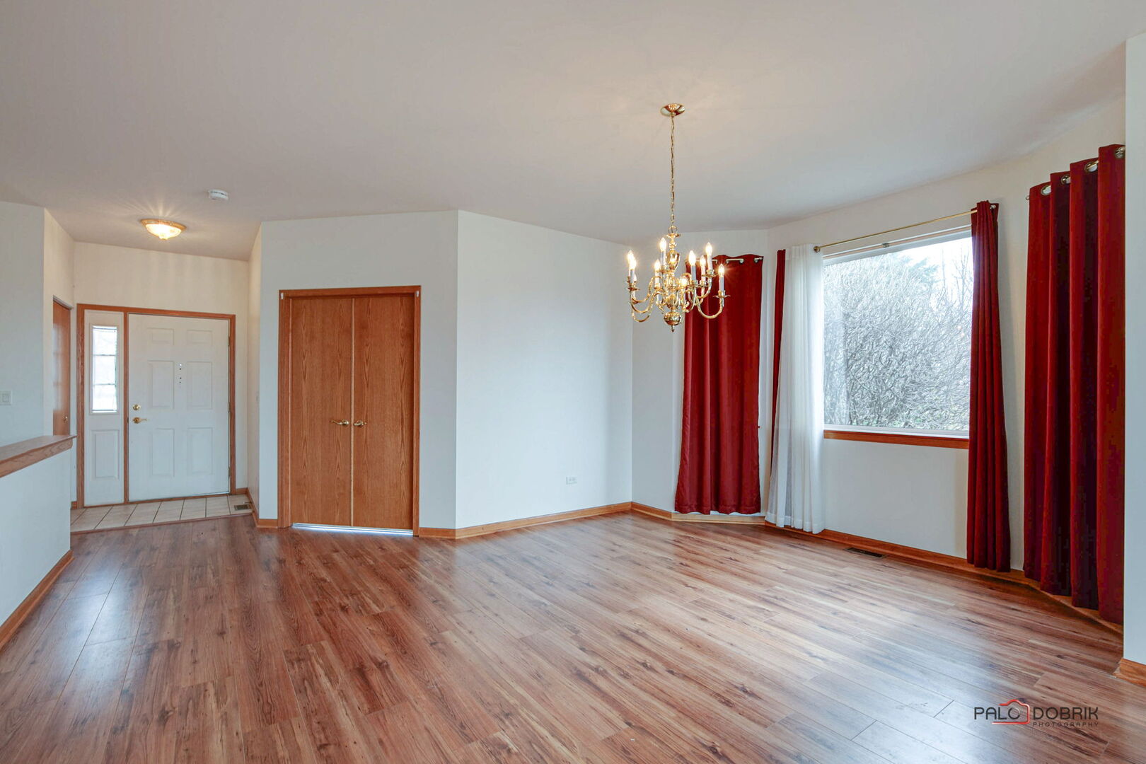 269 Enfield Lane Grayslake, IL 60030 - Photo 6 of 45 a view of a room with wooden floor and windows