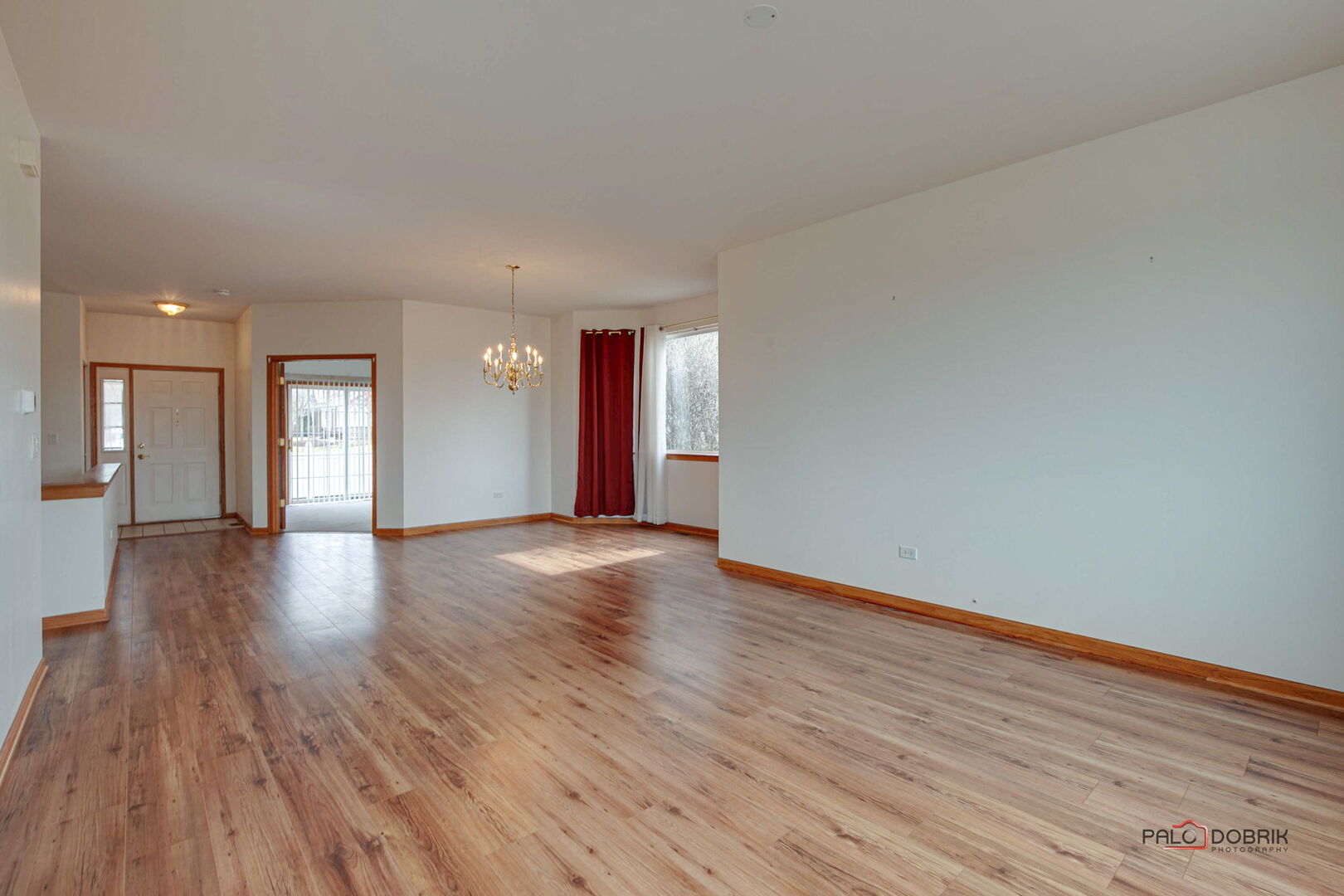 269 Enfield Lane Grayslake, IL 60030 - Photo 7 of 45 a view of an empty room with wooden floor and a window