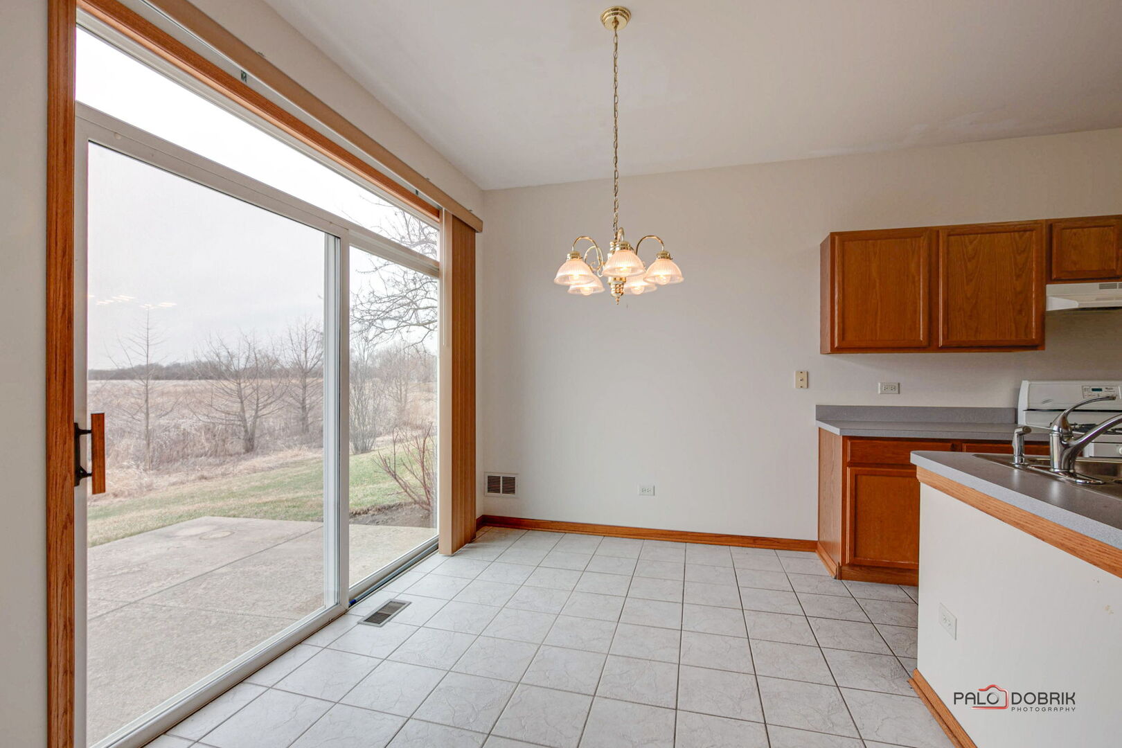 269 Enfield Lane Grayslake, IL 60030 - Photo 9 of 45 a view of a kitchen with granite countertop cabinets a sink and a counter top space