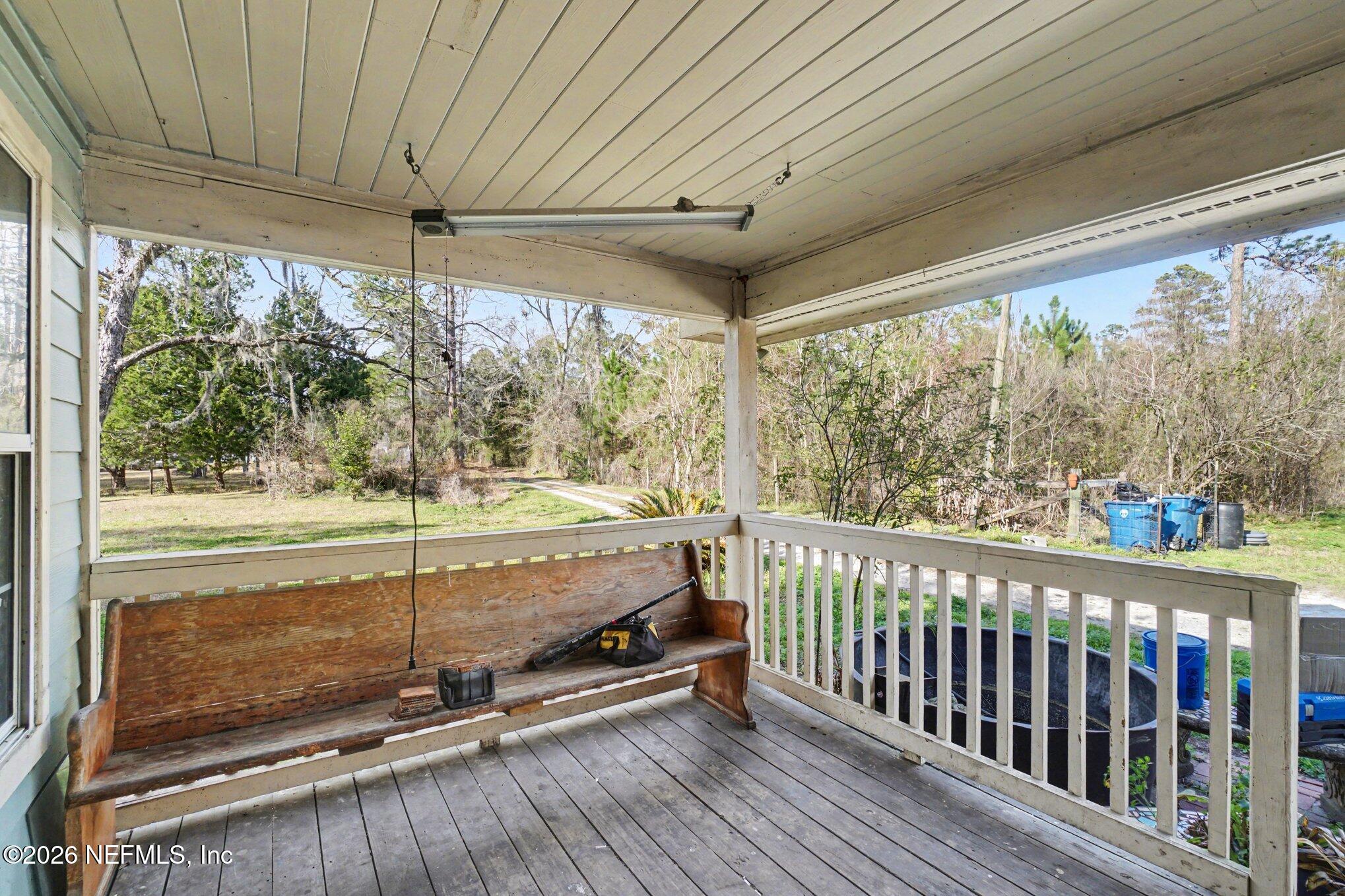 3390 Lannie Road Jacksonville, FL 32218 - Photo 12 of 18 a view of a room with wooden floor and outdoor space
