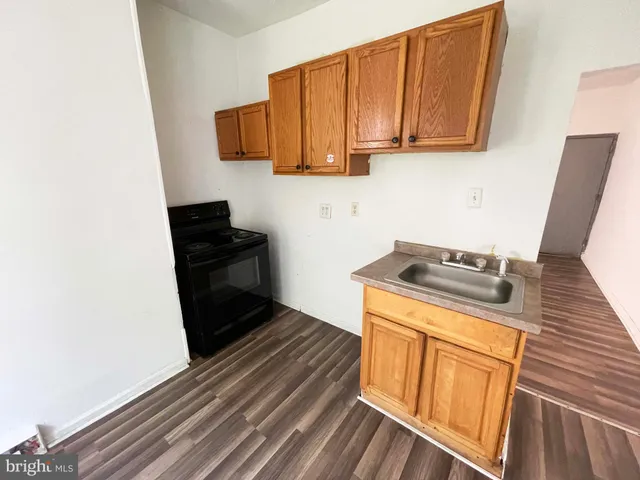 a kitchen with a stove top oven