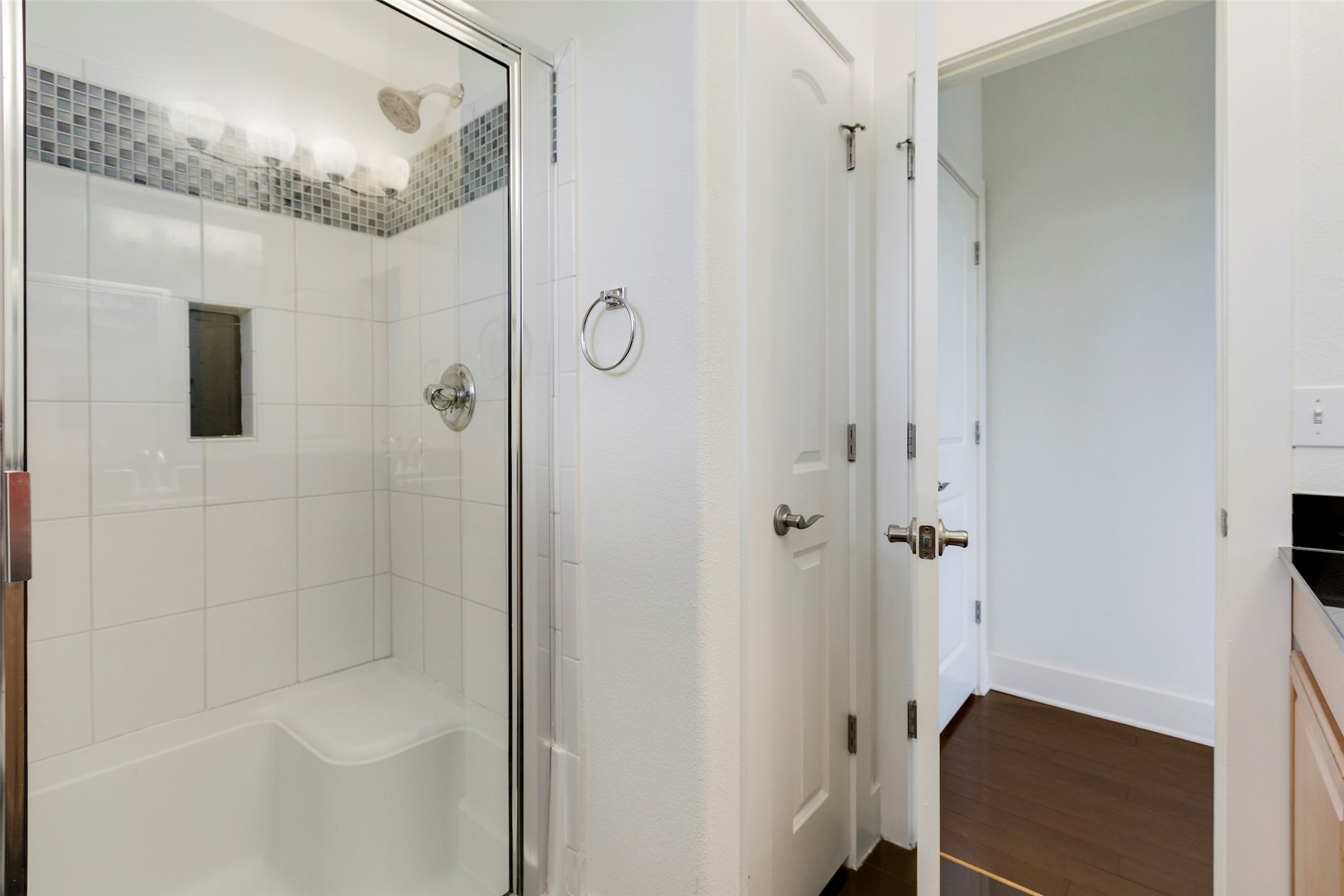 13420 Lyndhurst Street, Unit 308 Austin, TX 78717 - Photo 20 of 25 Bathroom featuring a stall shower and dark wood-style flooring