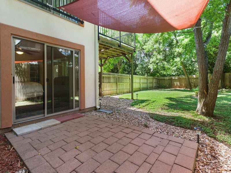 13420 Lyndhurst Street, Unit 308 Austin, TX 78717 - Photo 22 of 25 Fenced backyard featuring a patio