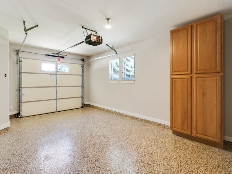 13420 Lyndhurst Street, Unit 308 Austin, TX 78717 - Photo 7 of 25 Garage with baseboards and a garage door opener