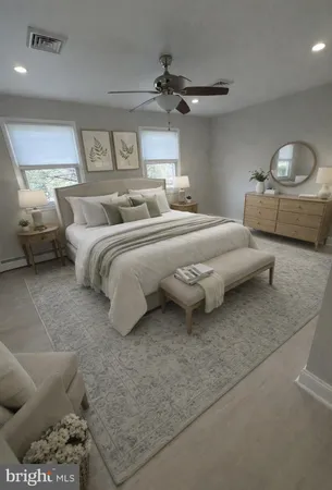 a spacious bedroom with a bed and a couch