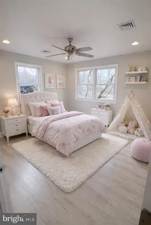 a bedroom with a large bed and a window