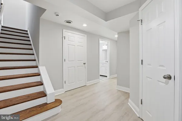 wooden floor in a hall with an entryway
