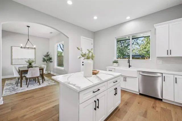 a bedroom with a bed and a lamp