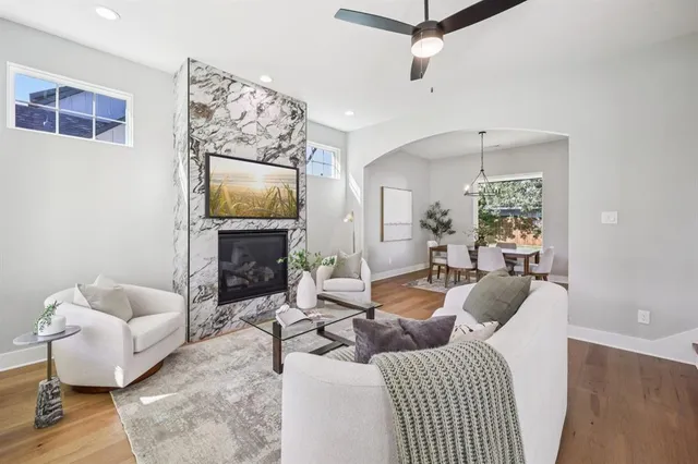 a living room with furniture and a fireplace