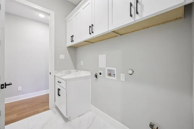 an empty room with a window and a ceiling fan