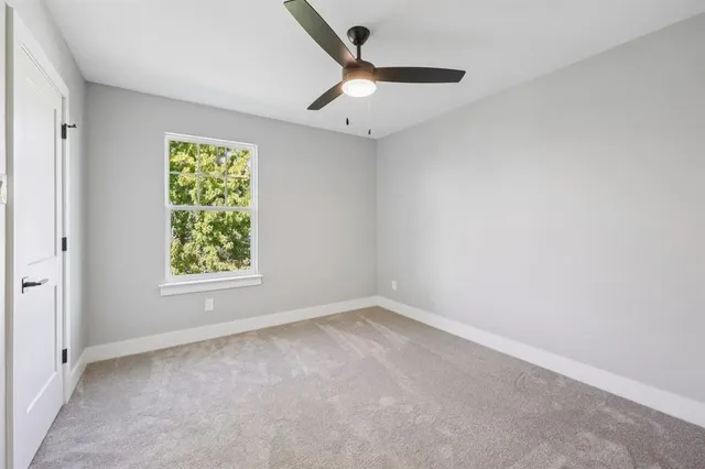 a view of a house with backyard and garden