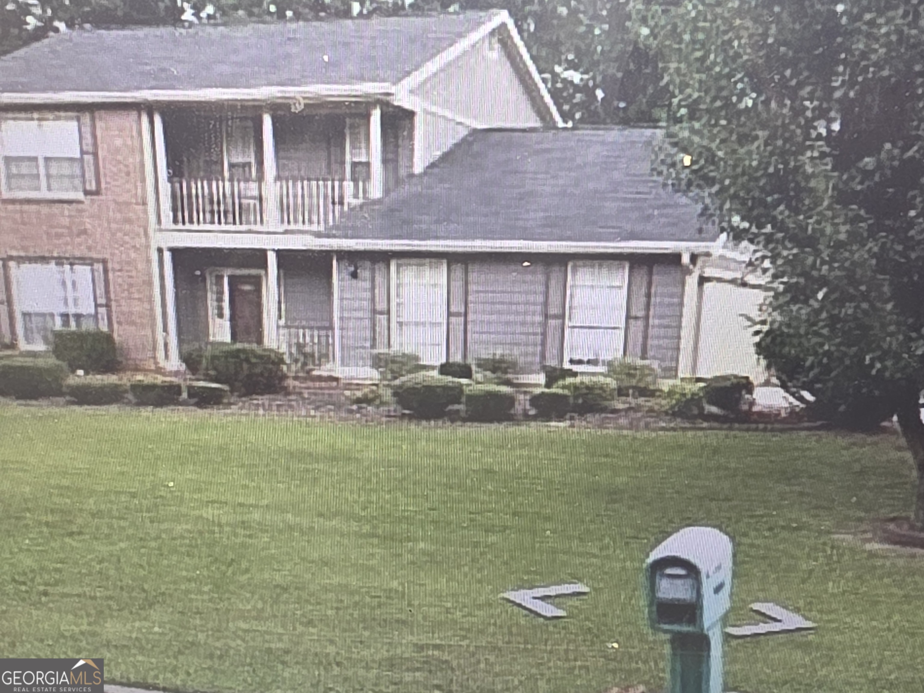 2635 Ashley Downs Lane South Fulton, GA 30349 - Photo 1 of 12 a front view of a house with garden