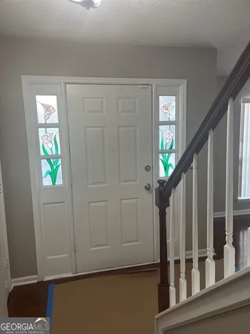 a view of entryway with wooden floor