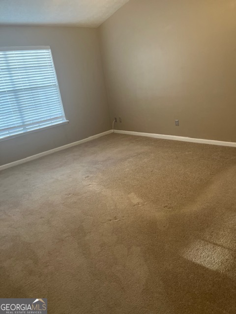 2635 Ashley Downs Lane South Fulton, GA 30349 - Photo 6 of 12 an empty room with a window