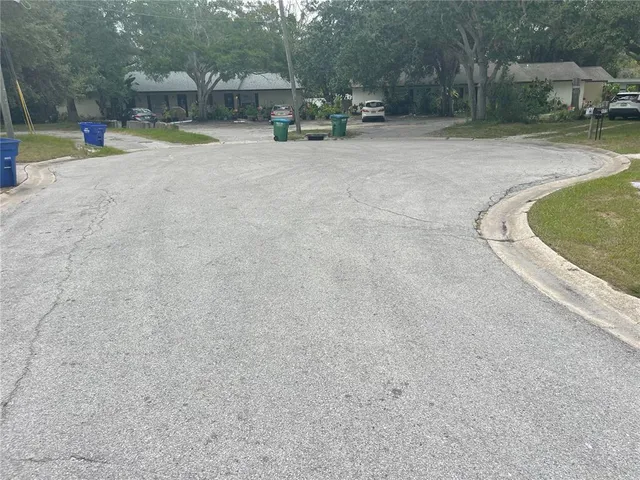 a view of a swimming pool with a patio and sitting area