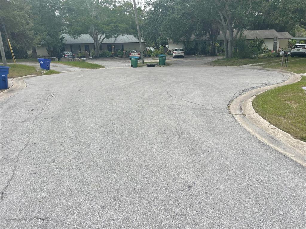 179 Margie Street Palm Harbor, FL 34683 - Photo 11 of 12 a view of a swimming pool with a patio and sitting area