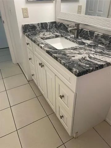 a close view of a sink and dishwasher