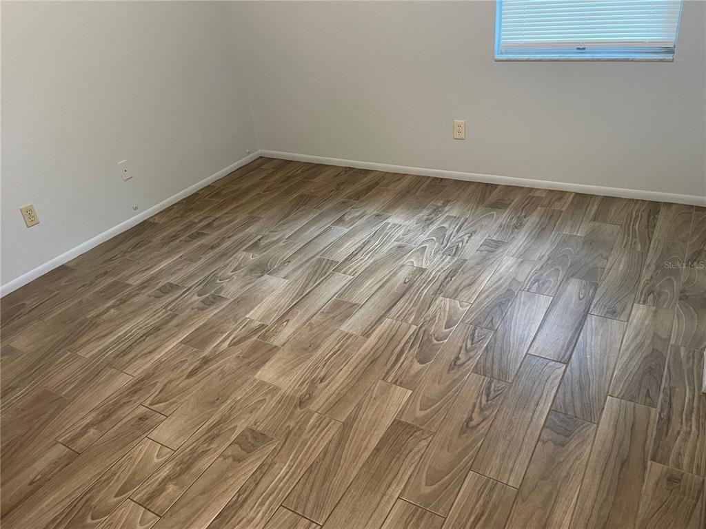 179 Margie Street Palm Harbor, FL 34683 - Photo 7 of 12 a view of a room with wooden floor