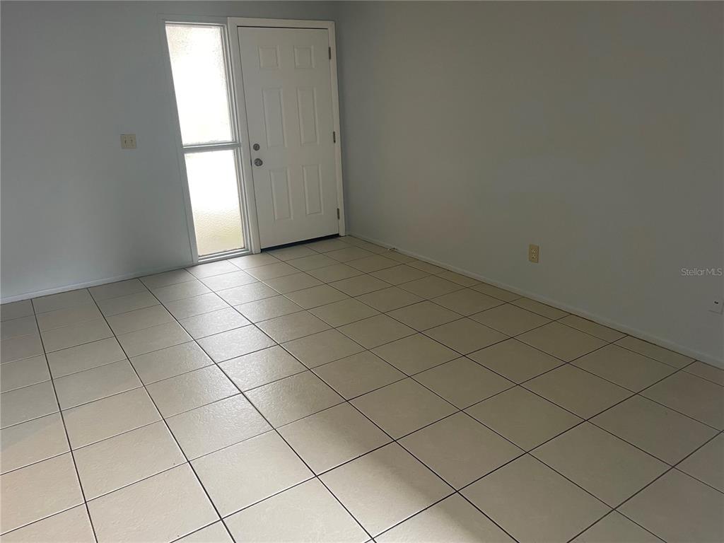 179 Margie Street Palm Harbor, FL 34683 - Photo 8 of 12 an empty room with a window