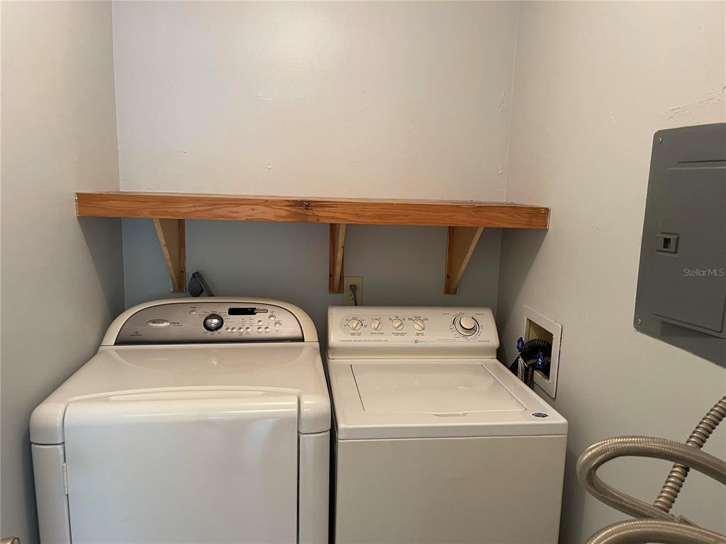 179 Margie Street Palm Harbor, FL 34683 - Photo 9 of 12 a utility room with dryer and washer