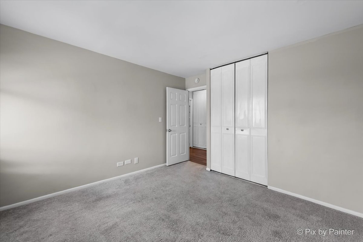 6207 Kit Carson Drive, Unit 6207 Hanover Park, IL 60133 - Photo 12 of 24 a view of an empty room