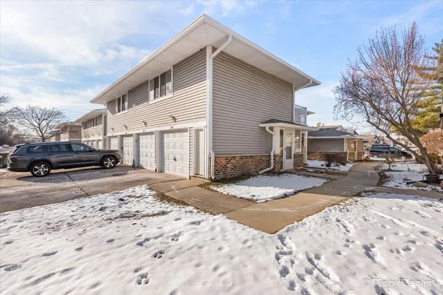 a view of a car park in front of a house