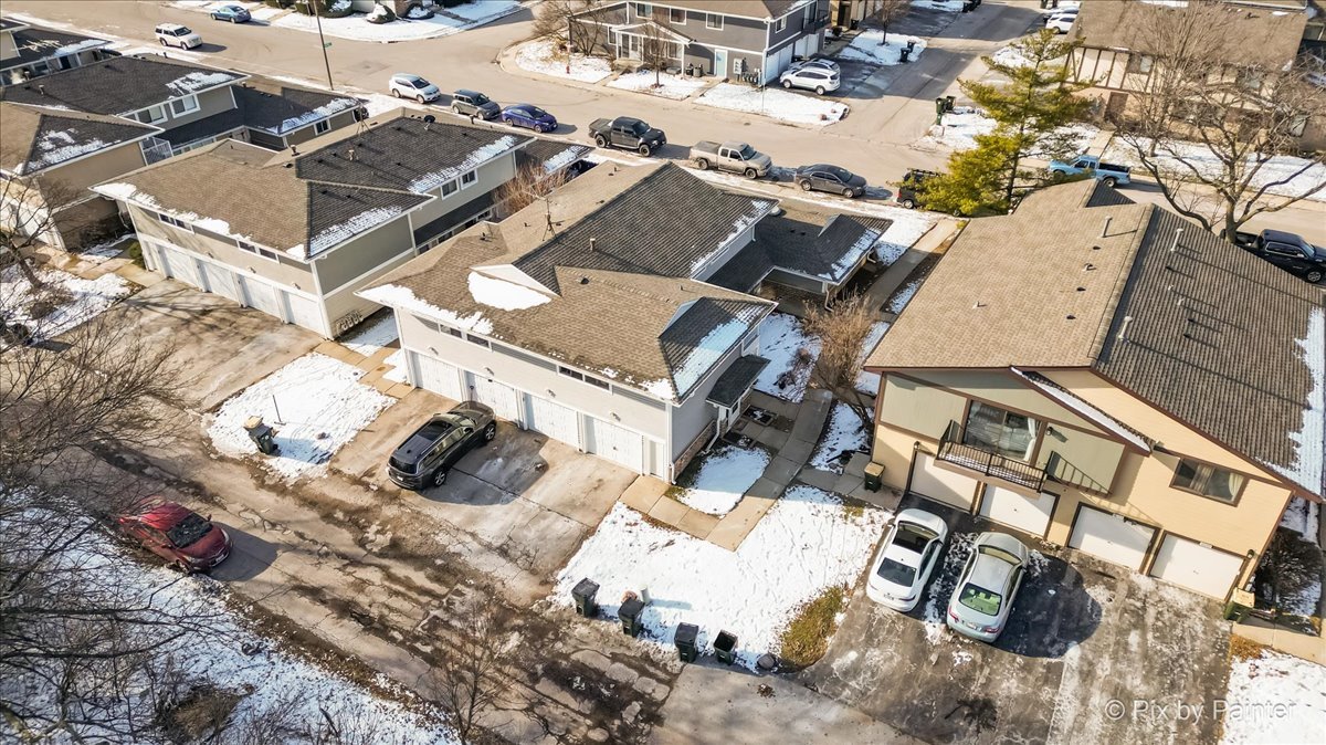 6207 Kit Carson Drive, Unit 6207 Hanover Park, IL 60133 - Photo 22 of 24 an aerial view of a house with a parking space