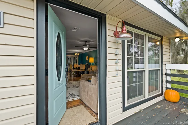 a view of a room with wooden floor and living room