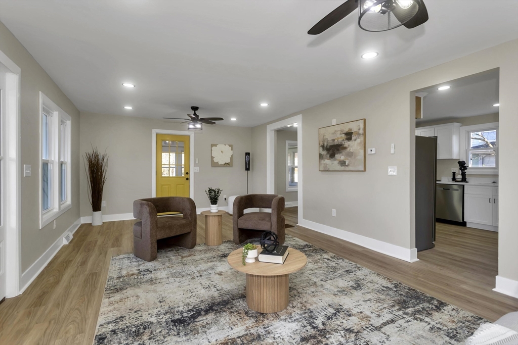 3 Norfolk Street Springfield, MA 01109 - Photo 18 of 42 a living room with furniture and a chandelier
