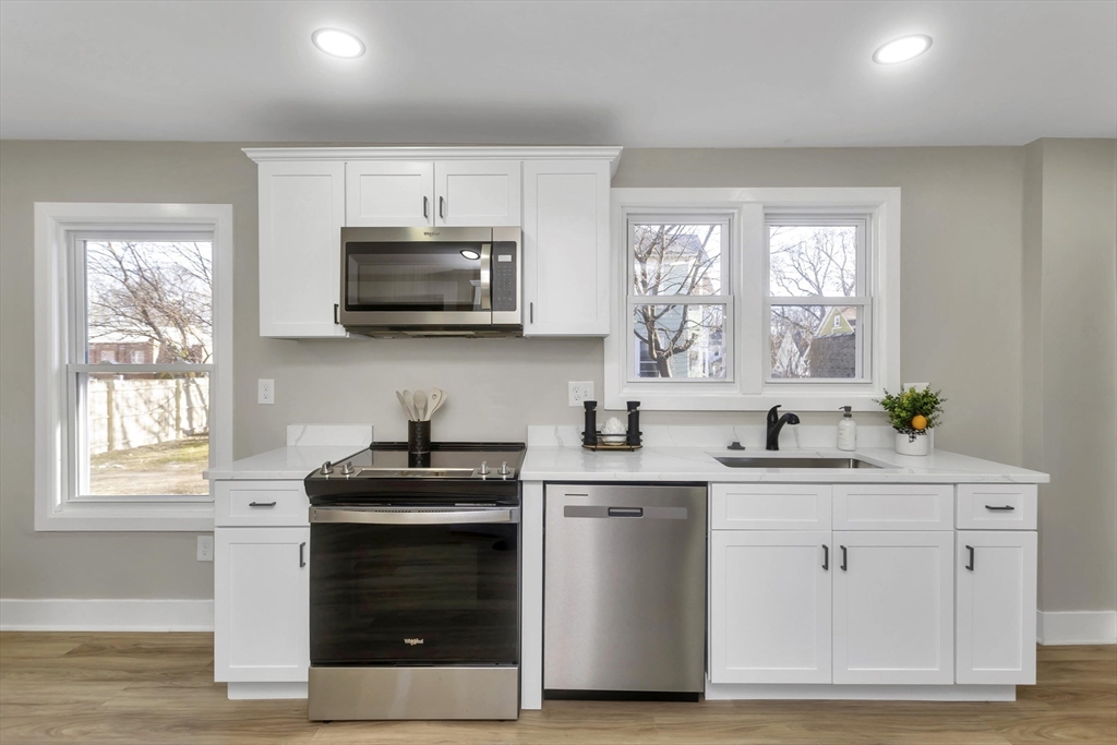 3 Norfolk Street Springfield, MA 01109 - Photo 20 of 42 a kitchen with a sink stove and microwave