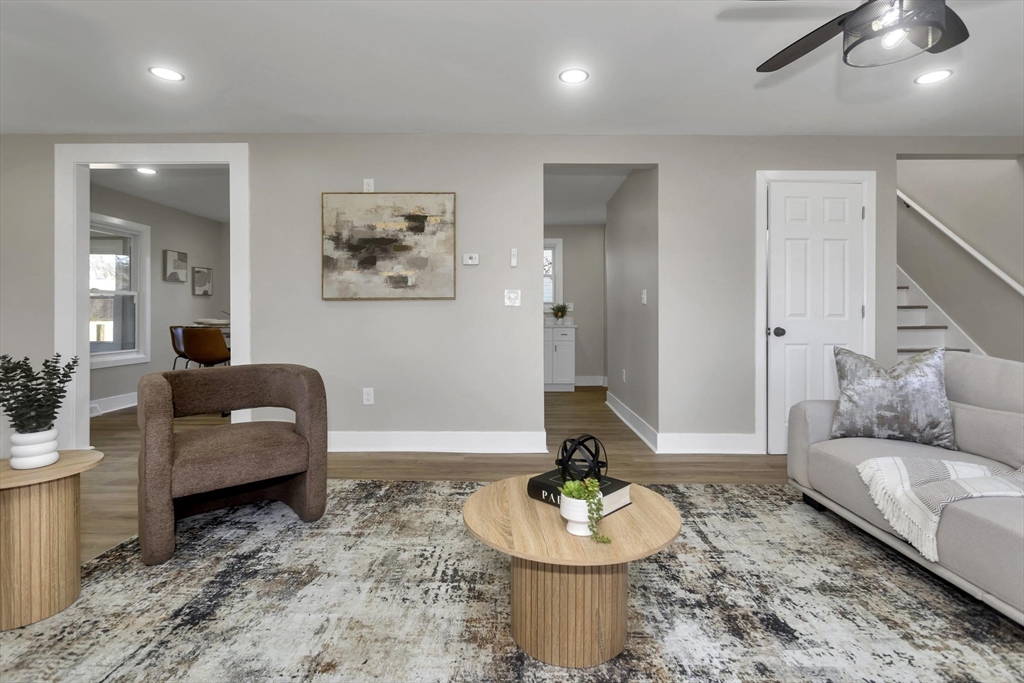 3 Norfolk Street Springfield, MA 01109 - Photo 27 of 42 a living room with furniture and a wooden floor