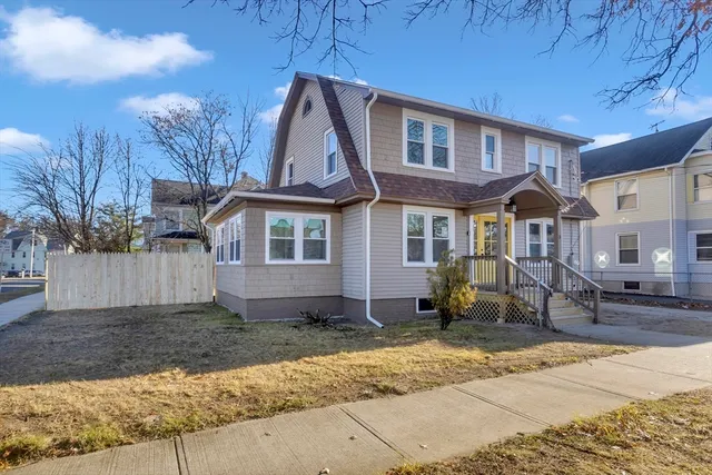 a front view of a house with a yard