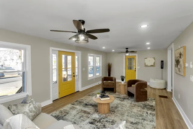 a living room with furniture and a large window