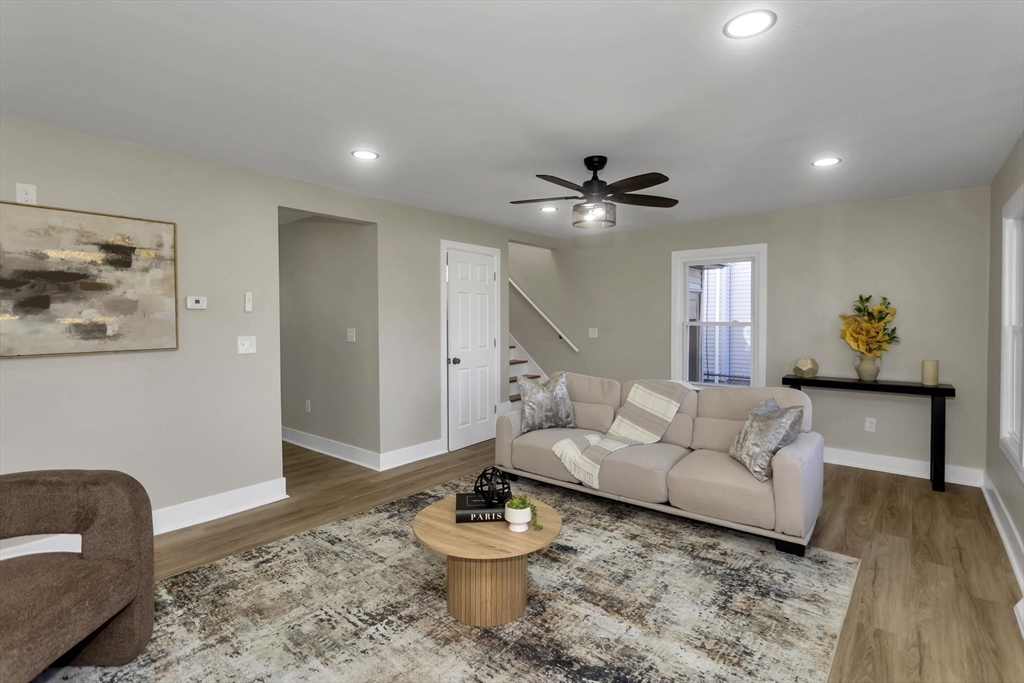 3 Norfolk Street Springfield, MA 01109 - Photo 7 of 42 a living room with furniture and a rug
