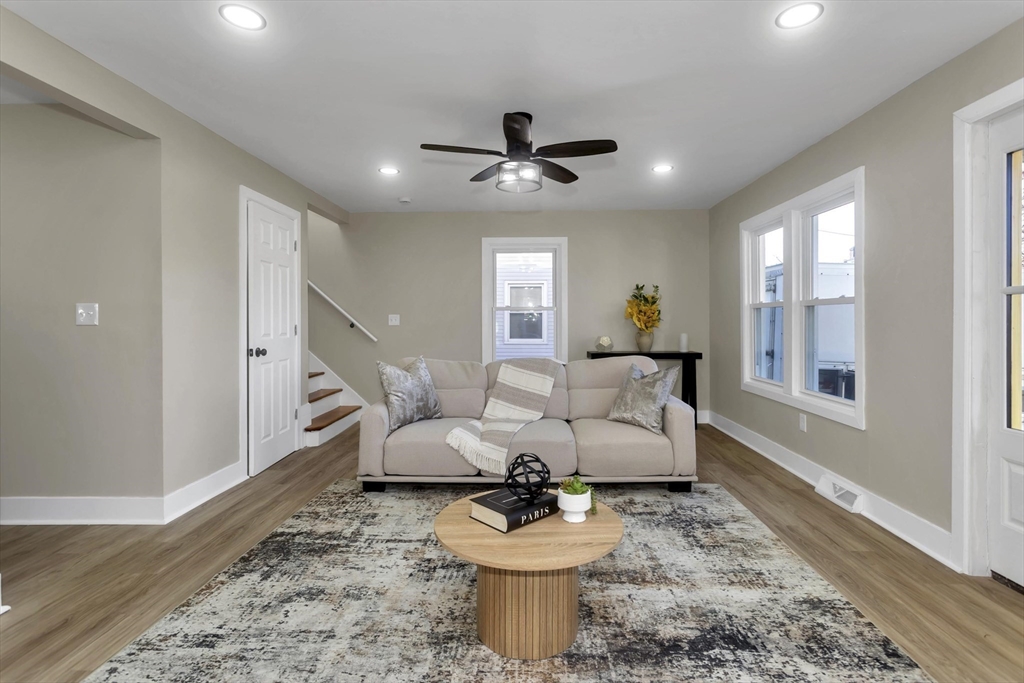 3 Norfolk Street Springfield, MA 01109 - Photo 9 of 42 a living room with furniture and a chandelier