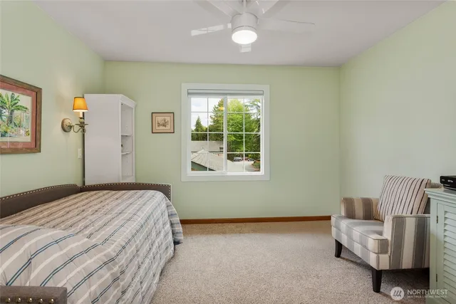 a bedroom with a bed and a couch