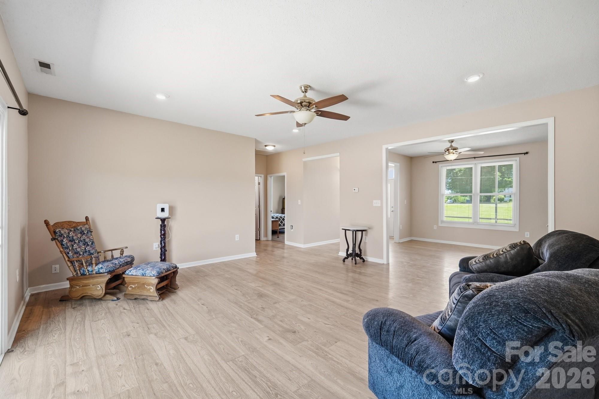 4415 Old Monroe Marshville Road Wingate, NC 28174 - Photo 6 of 28 a living room with furniture and a wooden floor