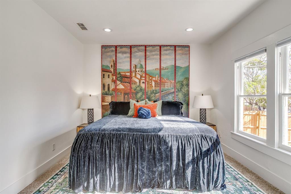 116 East Akard Street Weatherford, TX 76086 - Photo 15 of 32 a bedroom with a large bed and a large window