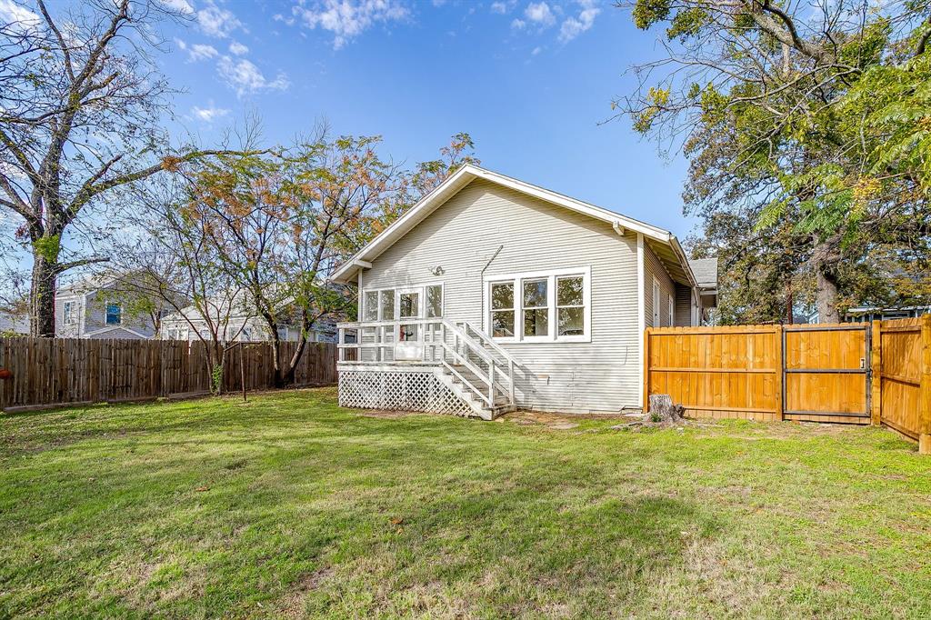 116 East Akard Street Weatherford, TX 76086 - Photo 31 of 32 a front view of house with yard and trees in the background