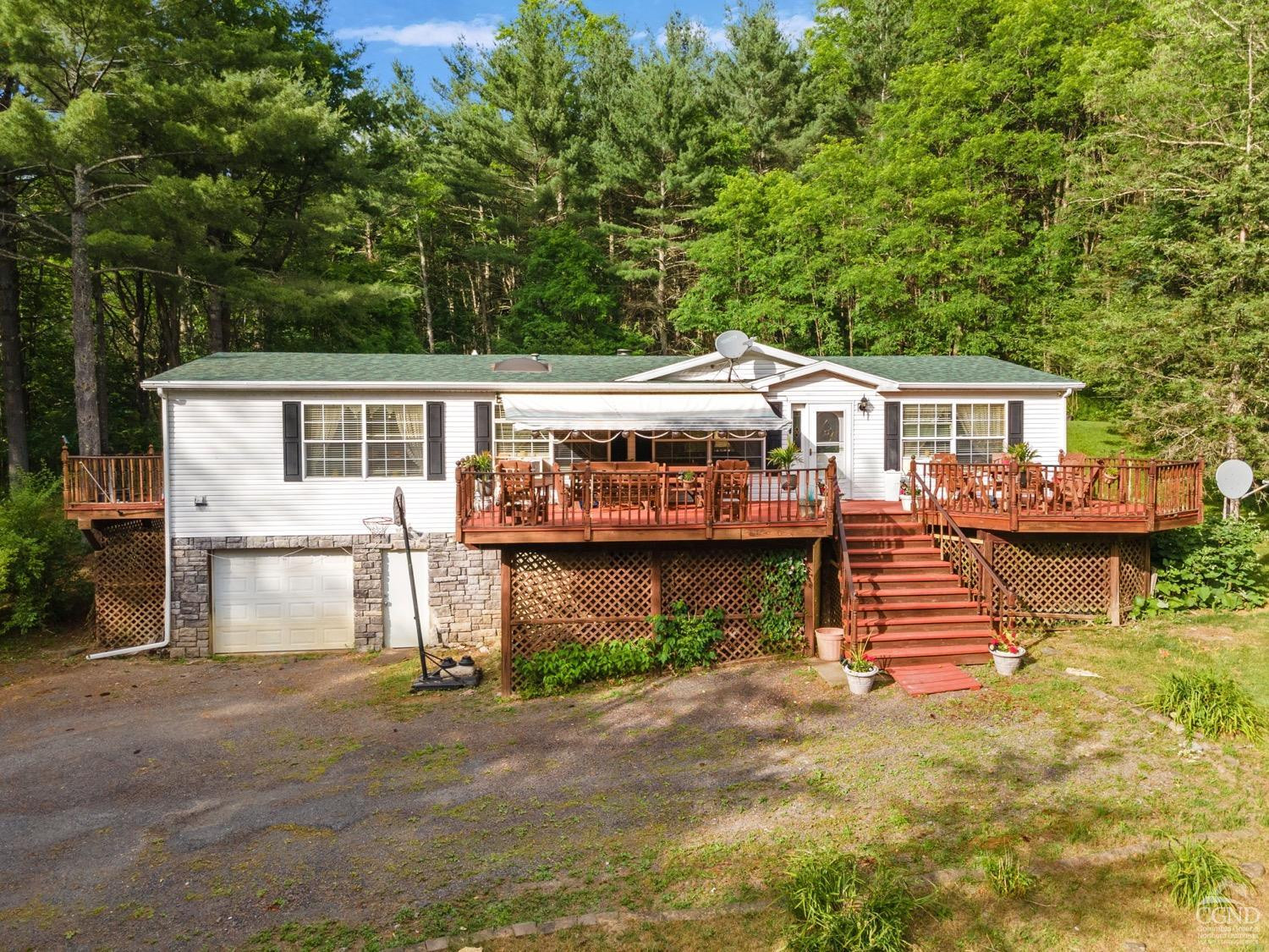 188 Taibbi Road Gilboa, NY 12076 - Photo 1 of 54 a view of a house with a yard and sitting area