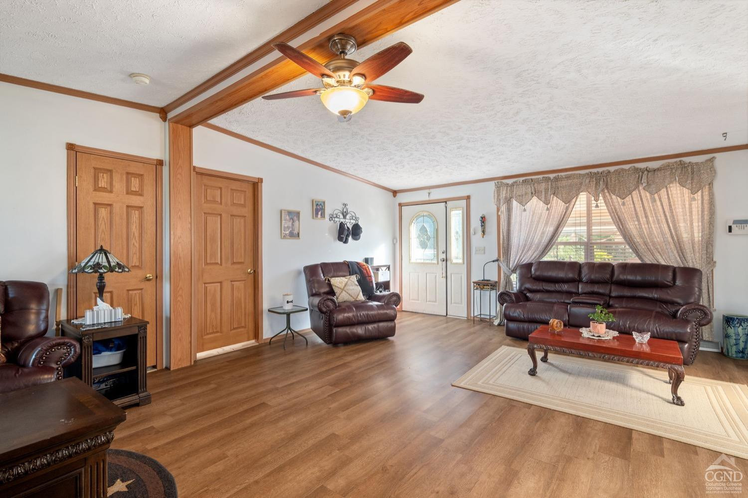 188 Taibbi Road Gilboa, NY 12076 - Photo 13 of 54 a living room with furniture and a wooden floor