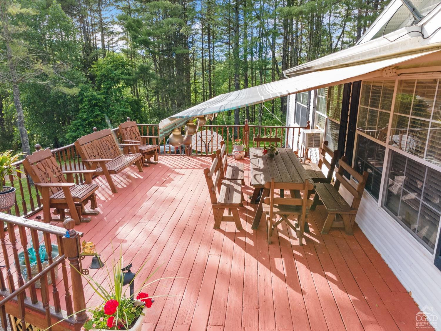 188 Taibbi Road Gilboa, NY 12076 - Photo 2 of 54 a view of balcony with wooden floor and outdoor seating