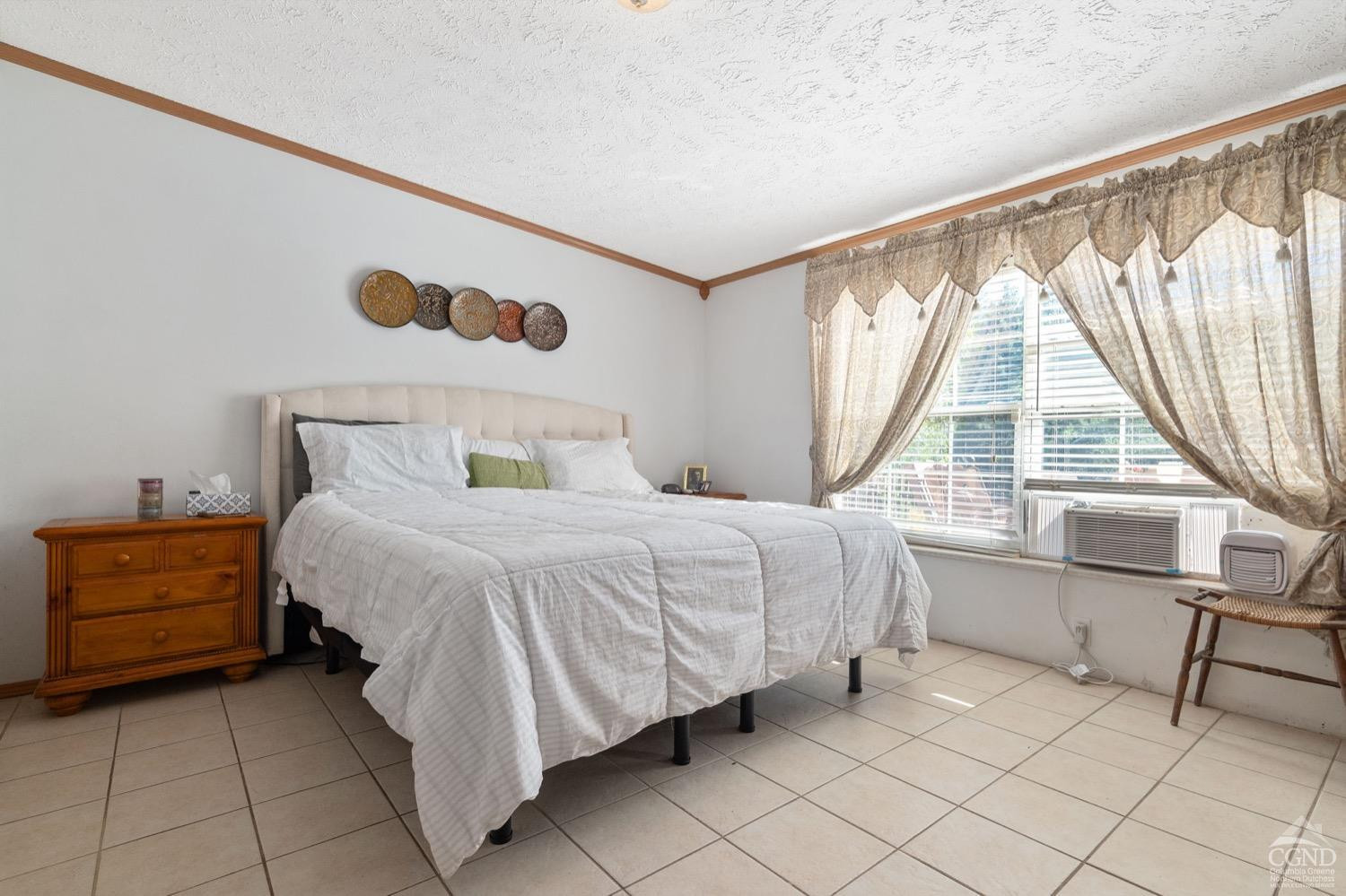 188 Taibbi Road Gilboa, NY 12076 - Photo 24 of 54 a bedroom with a bed and a large window