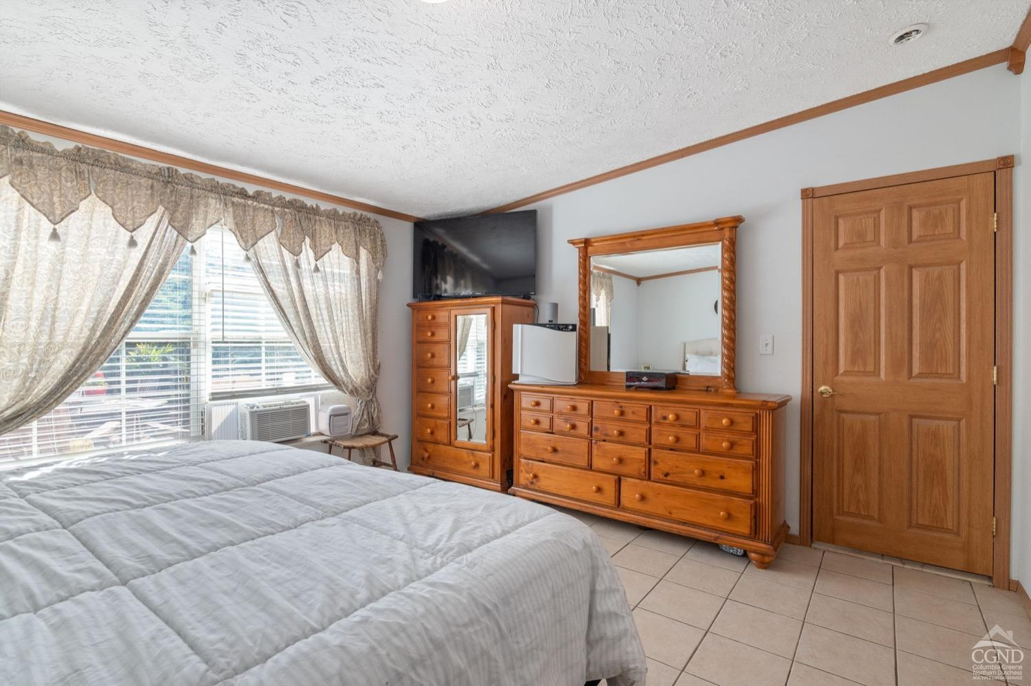 188 Taibbi Road Gilboa, NY 12076 - Photo 25 of 54 a bedroom with a bed and a dresser