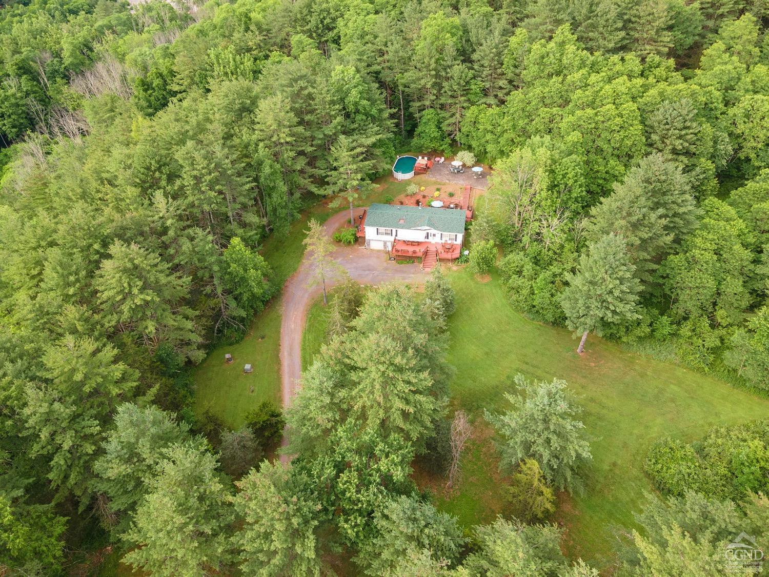 188 Taibbi Road Gilboa, NY 12076 - Photo 42 of 54 a picture of street view with large trees