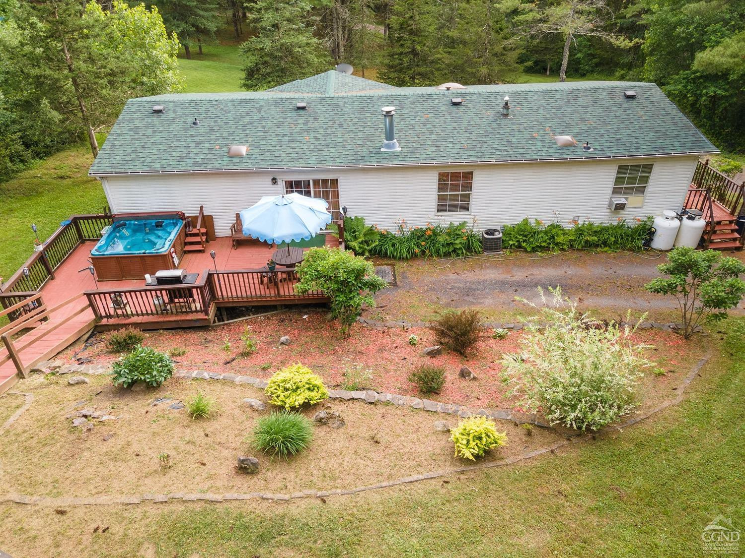188 Taibbi Road Gilboa, NY 12076 - Photo 6 of 54 an aerial view of a house with a yard and sitting area