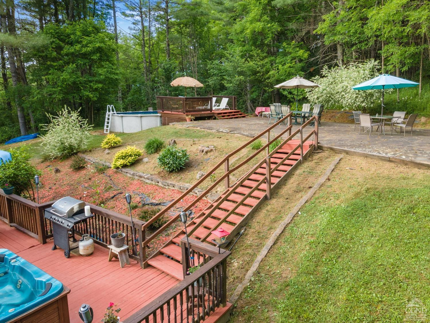 188 Taibbi Road Gilboa, NY 12076 - Photo 8 of 54 a view of a backyard with sitting area