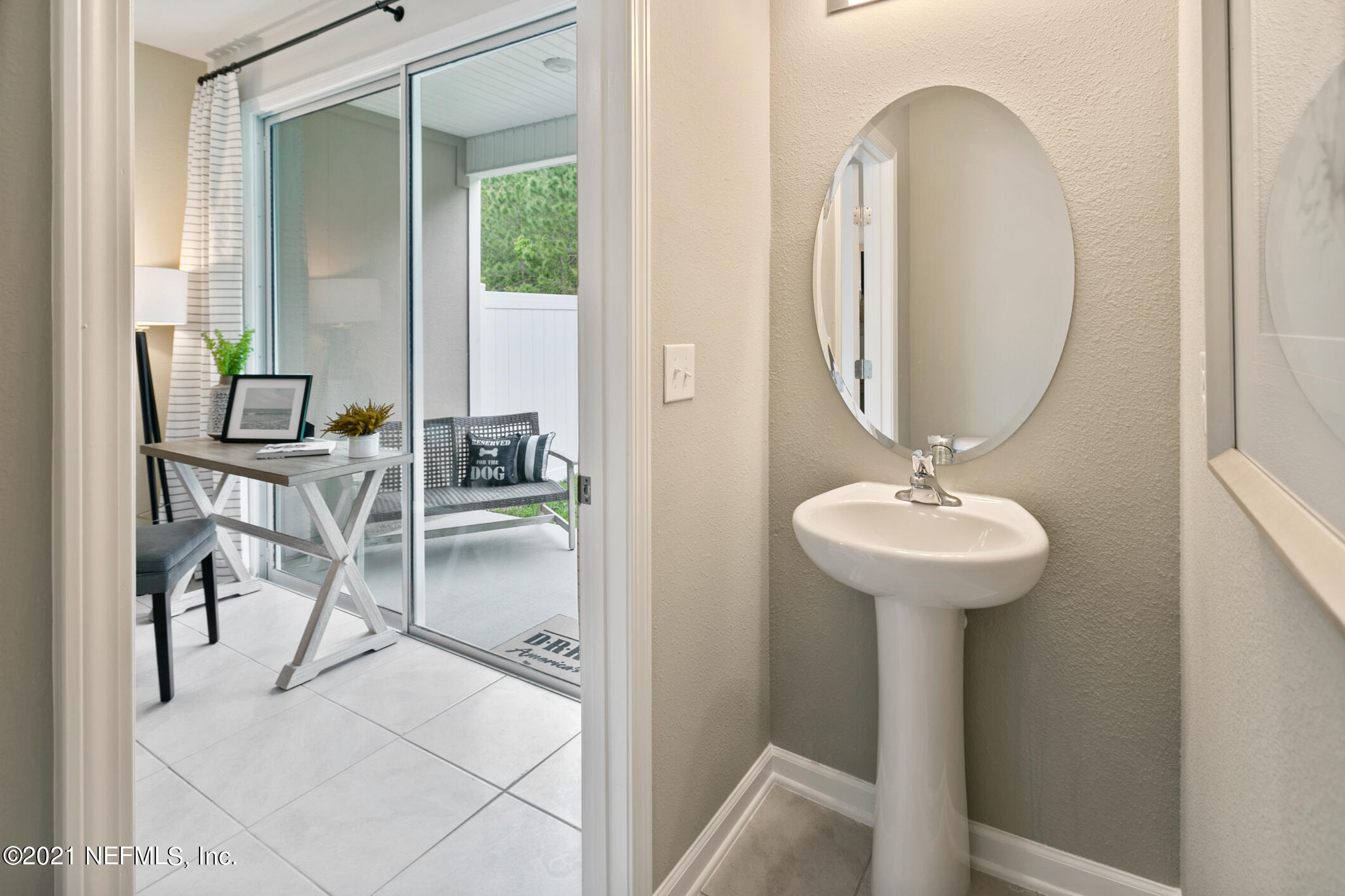 3972 Oak Mill Road Orange Park, FL 32065 - Photo 12 of 24 a bathroom with a sink and a mirror