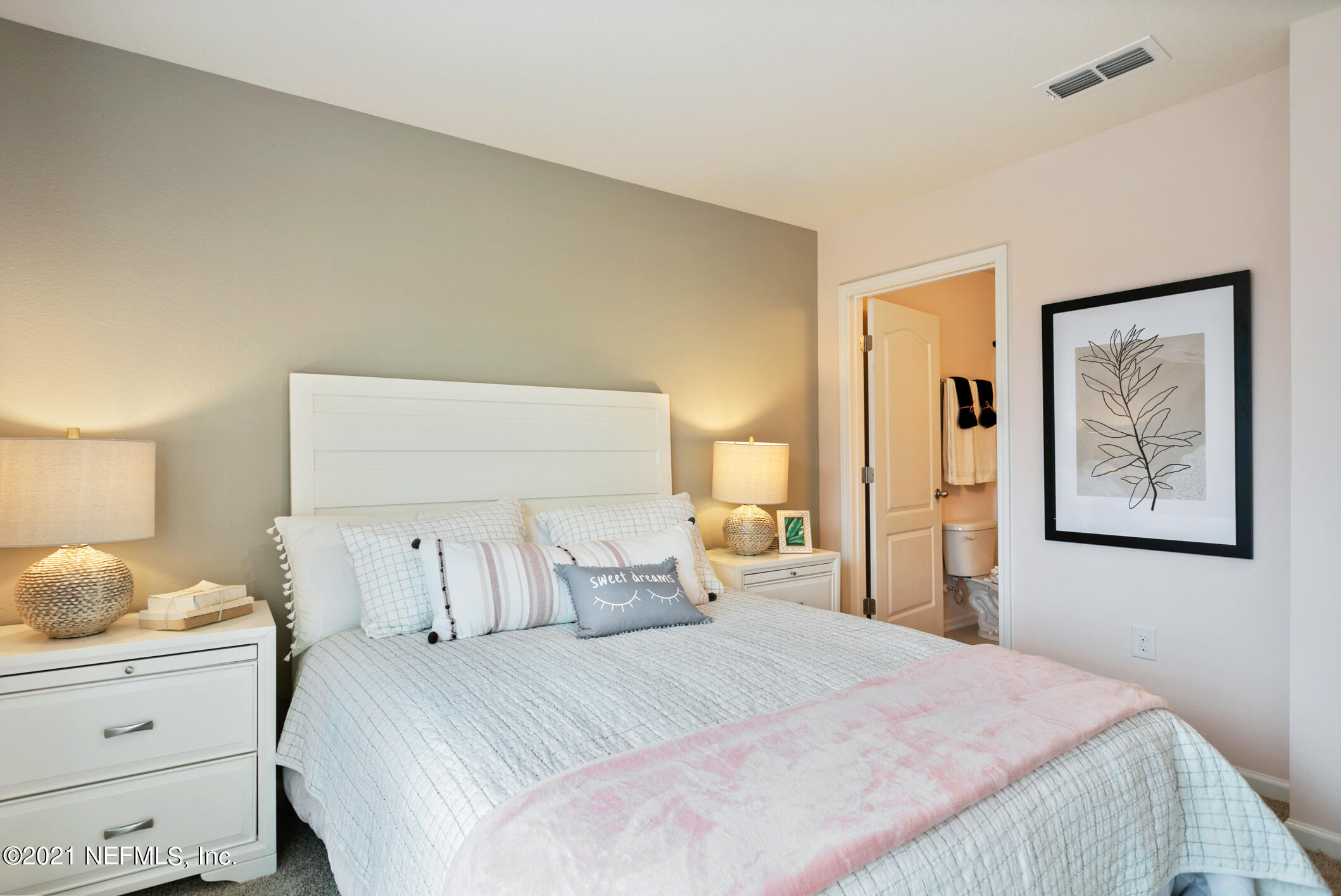 3972 Oak Mill Road Orange Park, FL 32065 - Photo 16 of 24 a bedroom with a bed and lamp