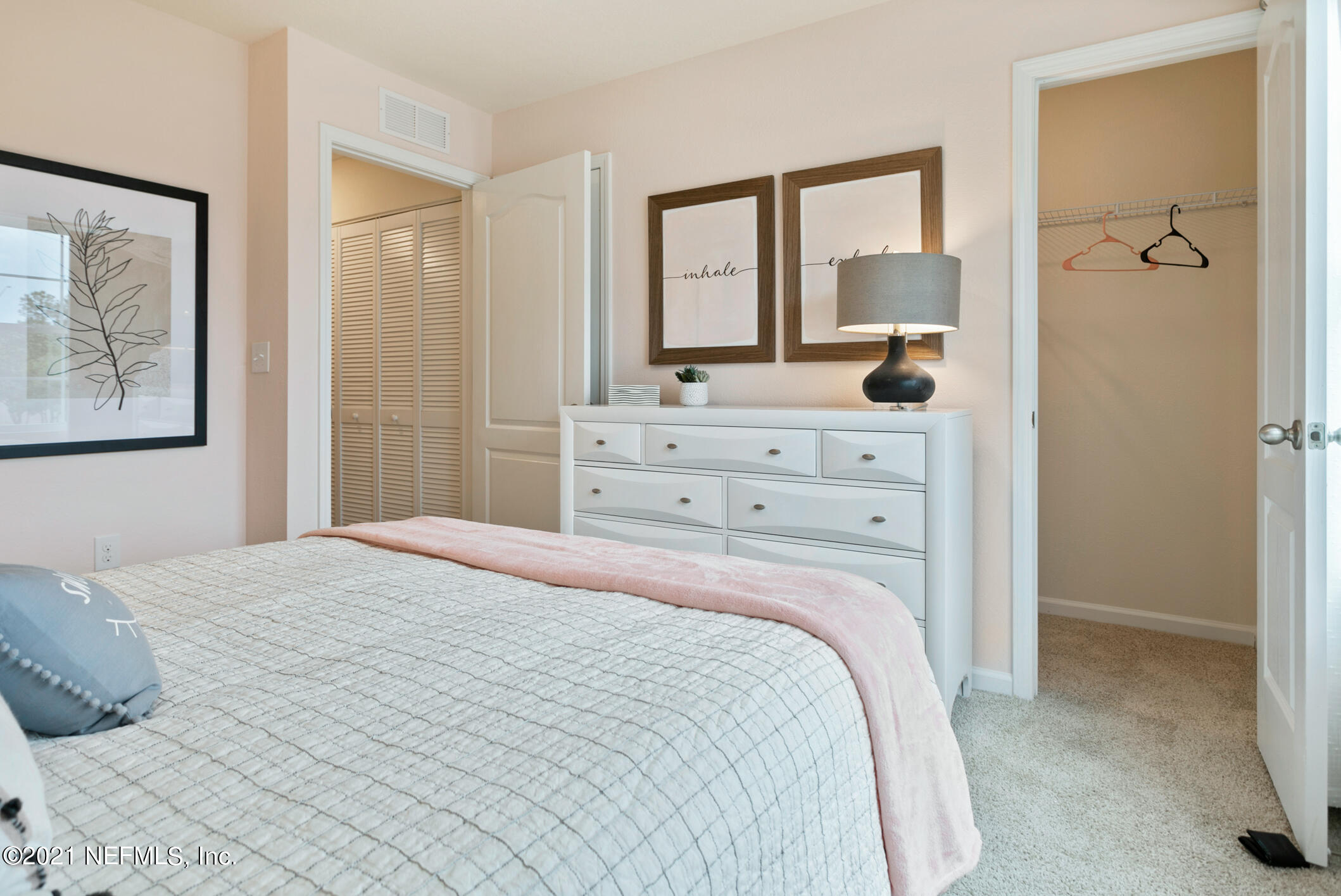 3972 Oak Mill Road Orange Park, FL 32065 - Photo 17 of 24 a bedroom with a bed and a large mirror